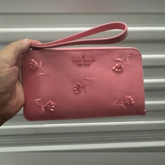 Kate Spade NWOT Floral Embossed Pink Wristlet - Picture 1 of 3